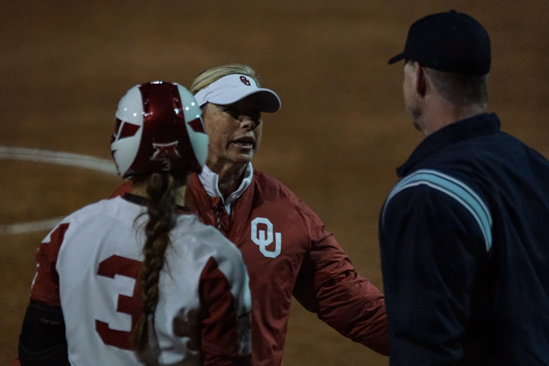Patty Gasso and umpire